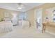 Bedroom with two twin beds, oval window, and doorway to another room at 2076 Rookery Ln, Charleston, SC 29414