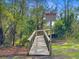 Wooden bridge leading through a natural landscape, featuring signage indicating no trespassing at 2076 Rookery Ln, Charleston, SC 29414