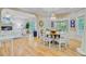 Open concept dining area with chandelier and views into the living room at 2076 Rookery Ln, Charleston, SC 29414