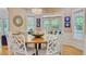 Dining area with hardwood floors and a decorative bowl of shells in the center at 2076 Rookery Ln, Charleston, SC 29414