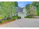 Charming two-story home featuring a spacious driveway, attached garage, and well-maintained landscaping at 2076 Rookery Ln, Charleston, SC 29414