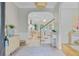 Bright foyer with elegant arched doorways, staircase and views to other rooms at 2076 Rookery Ln, Charleston, SC 29414