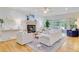 Bright living room features a fireplace, hardwood floors, and sliding doors to the outside at 2076 Rookery Ln, Charleston, SC 29414