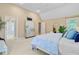 Bright main bedroom with vaulted ceiling, ensuite, dresser, decor and sitting area at 2076 Rookery Ln, Charleston, SC 29414