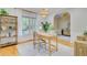 Bright home office with a large window, featuring a stylish desk and views to the front yard at 2076 Rookery Ln, Charleston, SC 29414