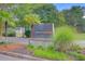 Welcome to Waccamaw Landing, with a beautifully landscaped entrance sign surrounded by lush trees and greenery at 2076 Rookery Ln, Charleston, SC 29414