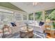 Bright sunroom featuring comfortable seating, stylish decor, and plenty of natural light at 2076 Rookery Ln, Charleston, SC 29414