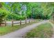 Scenic trail entrance featuring a wooden fence and well-maintained path for outdoor adventures at 2076 Rookery Ln, Charleston, SC 29414