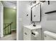 Modern bathroom vanity with new fixtures, mirror, and shelving, next to a toilet at 21 Rivers Point Row # Apt 11 C, Charleston, SC 29412
