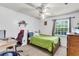 Bright bedroom featuring a ceiling fan, carpeted floors, and a cozy bed near a window at 21 Rivers Point Row # Apt 11 C, Charleston, SC 29412