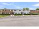 Exterior view of townhomes with well-maintained landscaping and a parking lot at 21 Rivers Point Row # Apt 11 C, Charleston, SC 29412