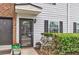 Charming front door with potted plants and fresh exterior paint welcomes you home at 21 Rivers Point Row # Apt 11 C, Charleston, SC 29412