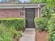 A welcoming laundry center door is set in brick with groomed green hedges at 21 Rivers Point Row # Apt 11 C, Charleston, SC 29412
