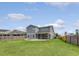 Spacious fenced backyard showcases a charming patio with a firepit, perfect for outdoor entertaining and relaxation at 212 Palmetto Walk Dr, Summerville, SC 29486