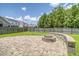 Paver patio features a charming fire pit and seat wall perfect for entertaining in a fenced yard at 212 Palmetto Walk Dr, Summerville, SC 29486