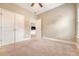 Comfortable bedroom featuring neutral carpet and a ceiling fan, creating a inviting space at 212 Palmetto Walk Dr, Summerville, SC 29486