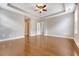 Large bedroom with tray ceilings, ceiling fan, recessed lighting, and beautiful hardwood flooring at 212 Palmetto Walk Dr, Summerville, SC 29486