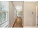 Bright hallway with hardwood floors, abundant natural light, and a clear view into other rooms of the home at 212 Palmetto Walk Dr, Summerville, SC 29486