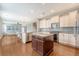 Open kitchen with stainless steel appliances, kitchen island, and views to the living area at 212 Palmetto Walk Dr, Summerville, SC 29486