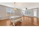 Open concept living area featuring hardwood floors, ample natural light, and casual dining at 212 Palmetto Walk Dr, Summerville, SC 29486