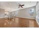 Open-concept living room featuring hardwood floors, ceiling fan, and lots of natural light at 212 Palmetto Walk Dr, Summerville, SC 29486
