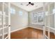 Bright office space with hardwood floors, natural light from windows, and a ceiling fan for added comfort at 212 Palmetto Walk Dr, Summerville, SC 29486