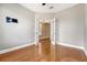 Versatile office space featuring hardwood floors, neutral walls, and glass French doors for privacy at 212 Palmetto Walk Dr, Summerville, SC 29486