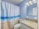 Classic bathroom with vanity, sink and tub-shower combo with a beachy shower curtain at 2120 Fife Ln, Charleston, SC 29414