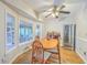 Cozy dining area featuring hardwood floors, a ceiling fan, and a wine cooler, with natural light at 2120 Fife Ln, Charleston, SC 29414