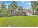 Beautiful brick home with blue shutters, a two-car garage, and well-maintained lawn and landscaping at 2120 Fife Ln, Charleston, SC 29414