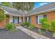 Attractive home entrance with brick accents, a well-lit walkway, and neatly trimmed landscaping at 2120 Fife Ln, Charleston, SC 29414