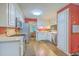 Traditional kitchen with white cabinets, stainless steel appliances, and wood-look flooring, offering a clean and functional space at 2120 Fife Ln, Charleston, SC 29414