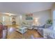 Bright living room with hardwood floors, comfortable seating, a piano, and plenty of natural light at 2120 Fife Ln, Charleston, SC 29414