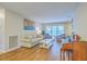 Inviting living room featuring neutral walls, hardwood floors, comfortable seating, and plenty of natural light at 2120 Fife Ln, Charleston, SC 29414