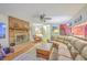 Spacious living room with a brick fireplace, comfortable seating, and a connected dining area, ideal for entertaining and Gathering time at 2120 Fife Ln, Charleston, SC 29414