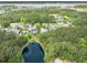 Aerial view of a community with a pond, lush trees, and well-maintained homes at 2132 Summerwood Dr, Mount Pleasant, SC 29466