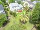 Aerial view of backyard featuring mature palm trees and a wooden deck at 2132 Summerwood Dr, Mount Pleasant, SC 29466