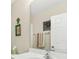 Bright bathroom features a large mirror, neutral paint, and a decorative turtle wall hanging at 2132 Summerwood Dr, Mount Pleasant, SC 29466