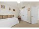 This carpeted bedroom has a daybed, a ceiling fan, and a double-door closet at 2132 Summerwood Dr, Mount Pleasant, SC 29466