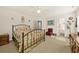 Bright bedroom features an iron bedframe, neutral carpet, and furnishings with a red chair at 2132 Summerwood Dr, Mount Pleasant, SC 29466