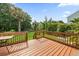 Wooden deck overlooking a well-maintained backyard with mature trees and landscaping at 2132 Summerwood Dr, Mount Pleasant, SC 29466