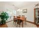 Dining area with a wooden table set, large window, and hardwood floors at 2132 Summerwood Dr, Mount Pleasant, SC 29466