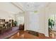 Inviting entryway with hardwood floors and a view to a bright seating area at 2132 Summerwood Dr, Mount Pleasant, SC 29466