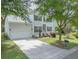 Charming two-story home with a well-maintained lawn, two car garage and inviting curb appeal at 2132 Summerwood Dr, Mount Pleasant, SC 29466