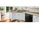 Bright kitchen with white cabinets, stainless steel sink, and hardwood floors at 2132 Summerwood Dr, Mount Pleasant, SC 29466