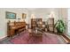 Cozy living room featuring a piano, stylish bookcase, and ample natural light at 2132 Summerwood Dr, Mount Pleasant, SC 29466