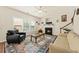Bright living room features a fireplace, ceiling fan, multiple windows and a decorative rug at 2132 Summerwood Dr, Mount Pleasant, SC 29466