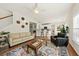 Spacious living room with hardwood floors, fireplace, and access to the kitchen at 2132 Summerwood Dr, Mount Pleasant, SC 29466