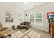 This cozy sitting room features a comfortable chaise lounge and lots of natural light at 2132 Summerwood Dr, Mount Pleasant, SC 29466