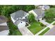 Aerial view of a lovely home with a manicured lawn, mature tree, and a long driveway leading to a two-car garage at 218 Austin Creek Ct, Summerville, SC 29483